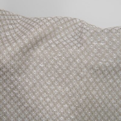 Linen cotton fabric dark beige and white diamonds close up detail