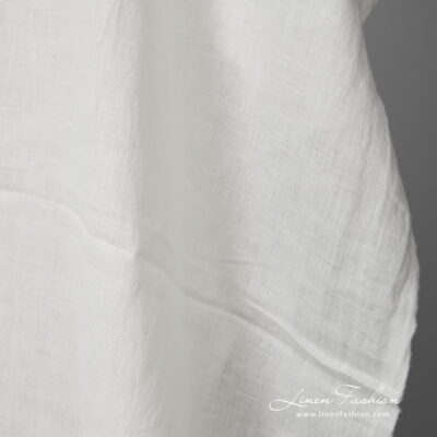 Lightweight washed linen fabric white colour close up view