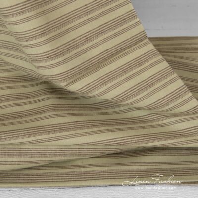 Pale green dyed linen cotton fabric.