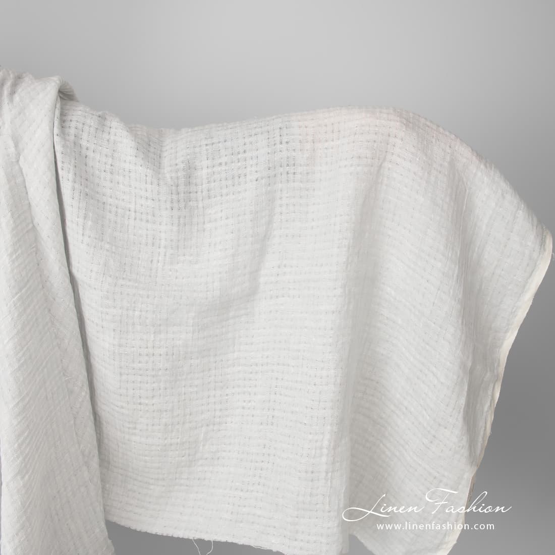 Light grey openwork linen fabric, washed