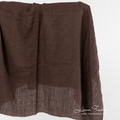 Washed linen fabric brown with vertical stripes 5 Brown linen fabric with vertical stripes.