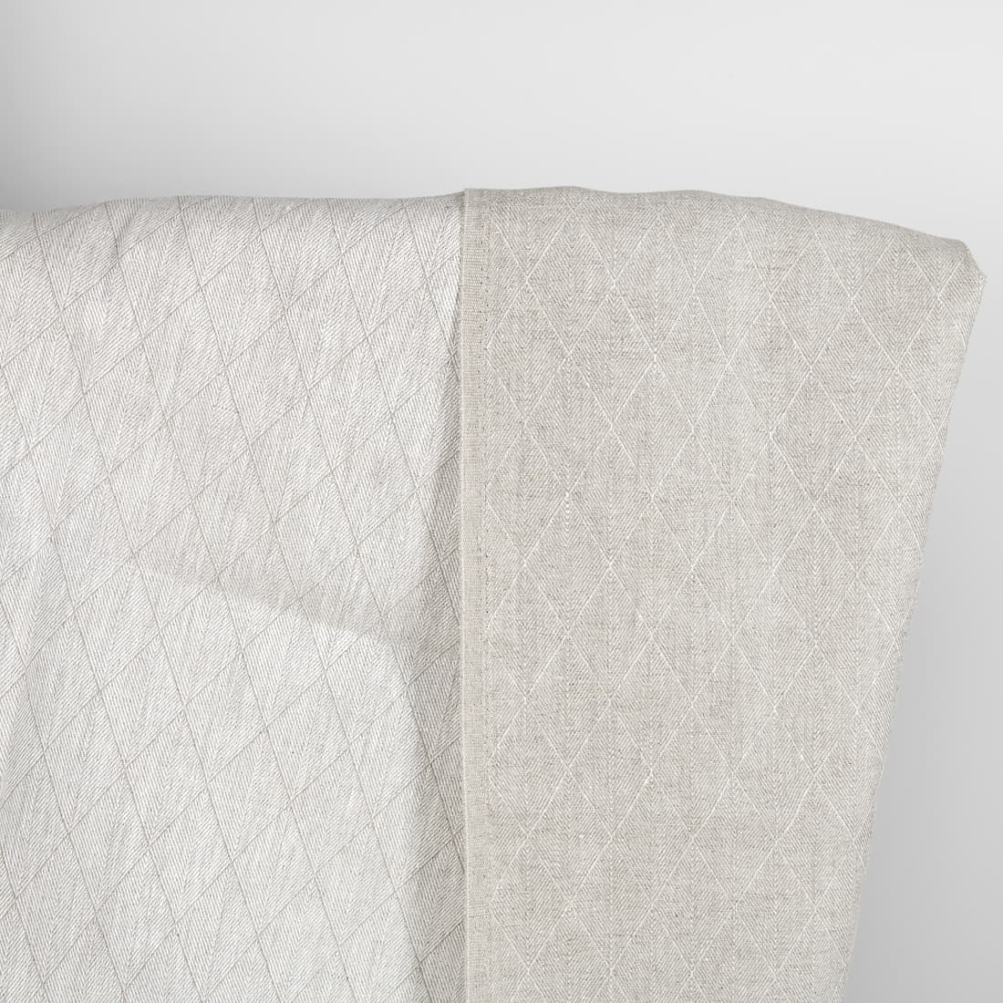 Beige double-sided linen fabric in a diamond pattern