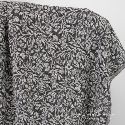 Black linen cotton jacquard fabric with flowery ornaments, washed