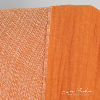 Double-sided orange linen fabric in checks, washed