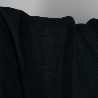 Washed linen wool fabric black in herringbone pattern 6 Washed linen wool fabric black in herringbone pattern close up detail