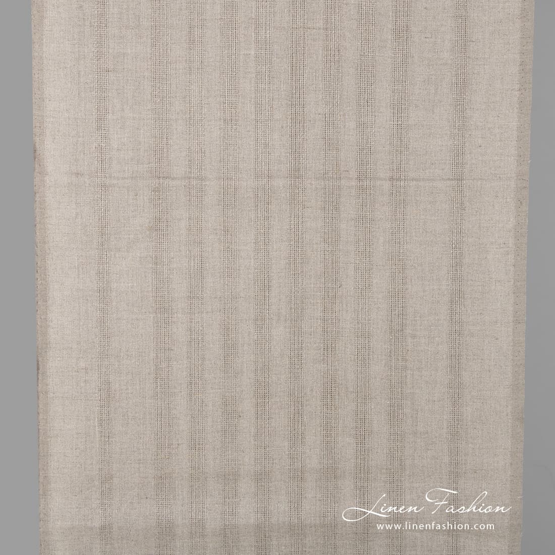 Linen fabric in natural flax colour with stripes.