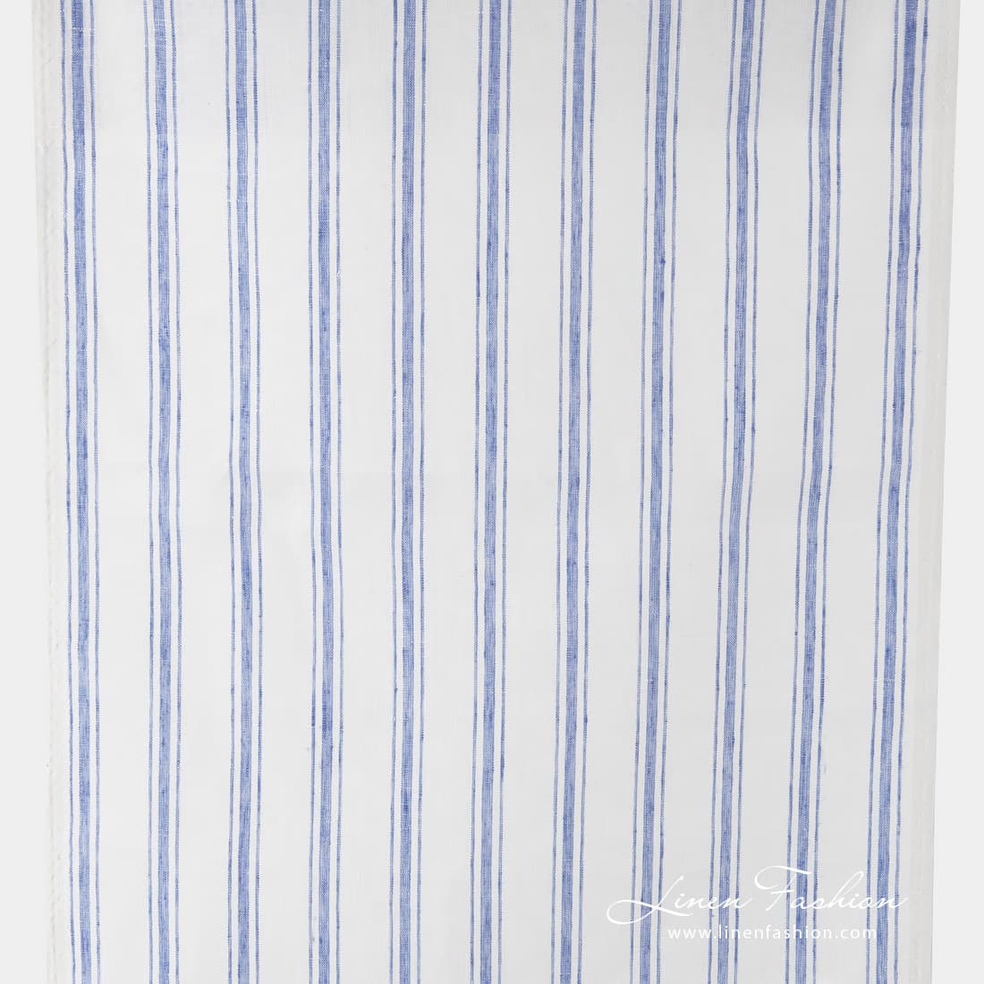 Off white narrow fabric with blue stripes.