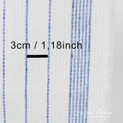 Off white linen fabric with blue stripes.