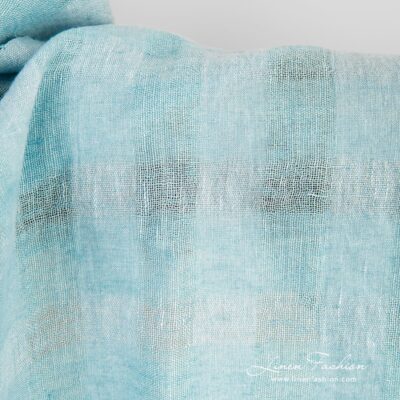 Light blue linen fabric in transparent checks washed 7 Linen fabric in light blue and light turquoise melange