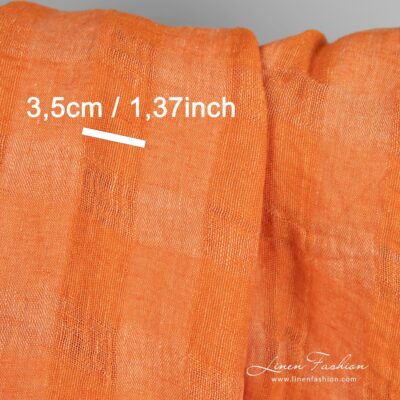 Linen fabric in transparent checks woven from orange and peach yarns