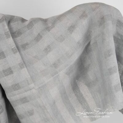 Grey linen fabric with sheer checks.