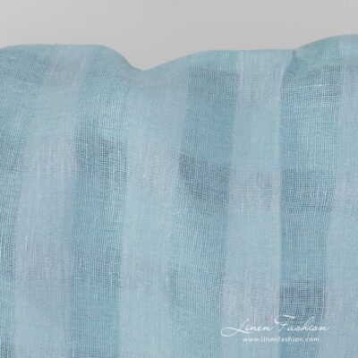 Linen fabric with checks in aquamarine colour 6 Aquamarine coloured linen fabric.