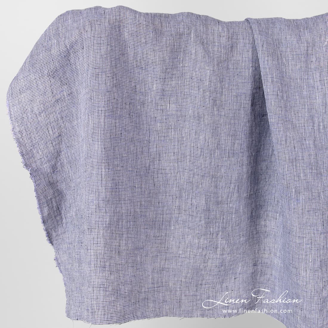 Linen fabric in black violet checks, washed.