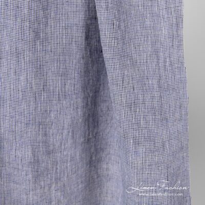 Washed 100% linen fabric in black violet checks.