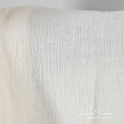 Linen fabric in off-white color, plain weave pattern