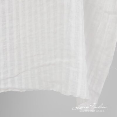 Washed off-white striped linen fabric 7 Striped 100% linen fabric in off white colour.