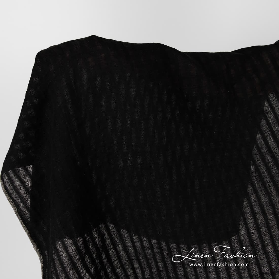 Washed black striped linen fabric.