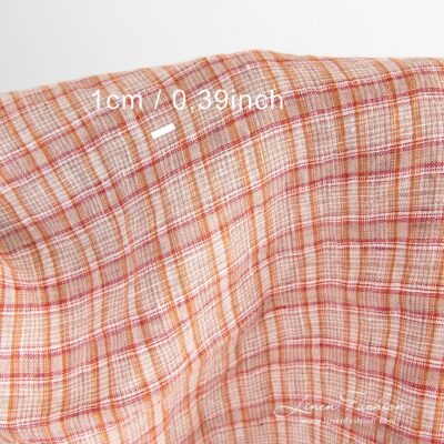 Orange linen fabric in checks washed 8 Checked linen fabric woven in white, orange, brown and red yarns