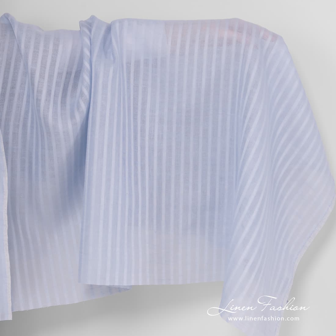 Light blue linen fabric with open weave pattern.