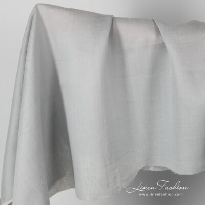 Patterned grey linen fabric.