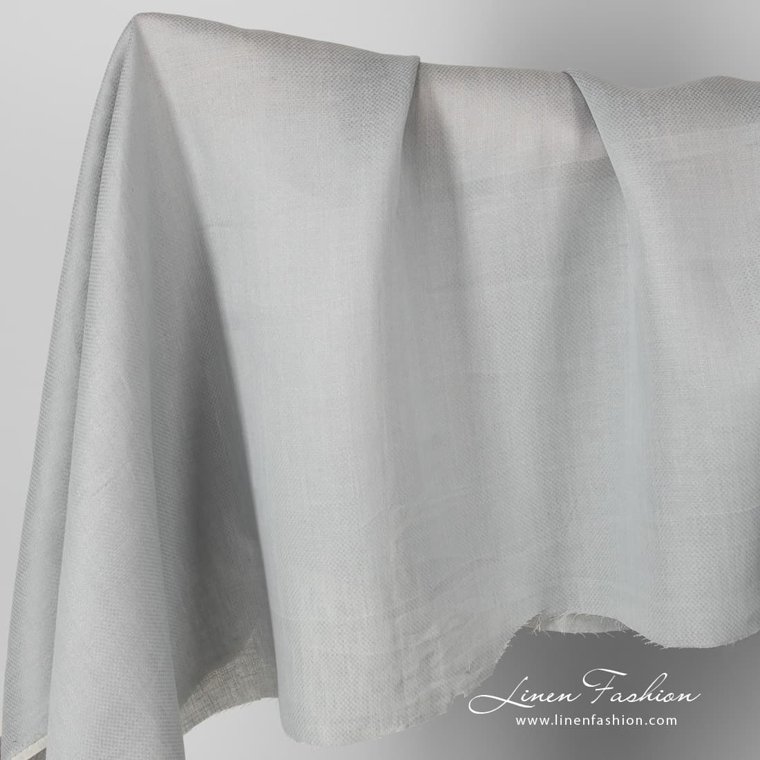 Patterned grey linen fabric.