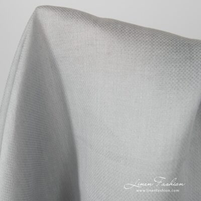Grey coloured linen fabric, patterned.