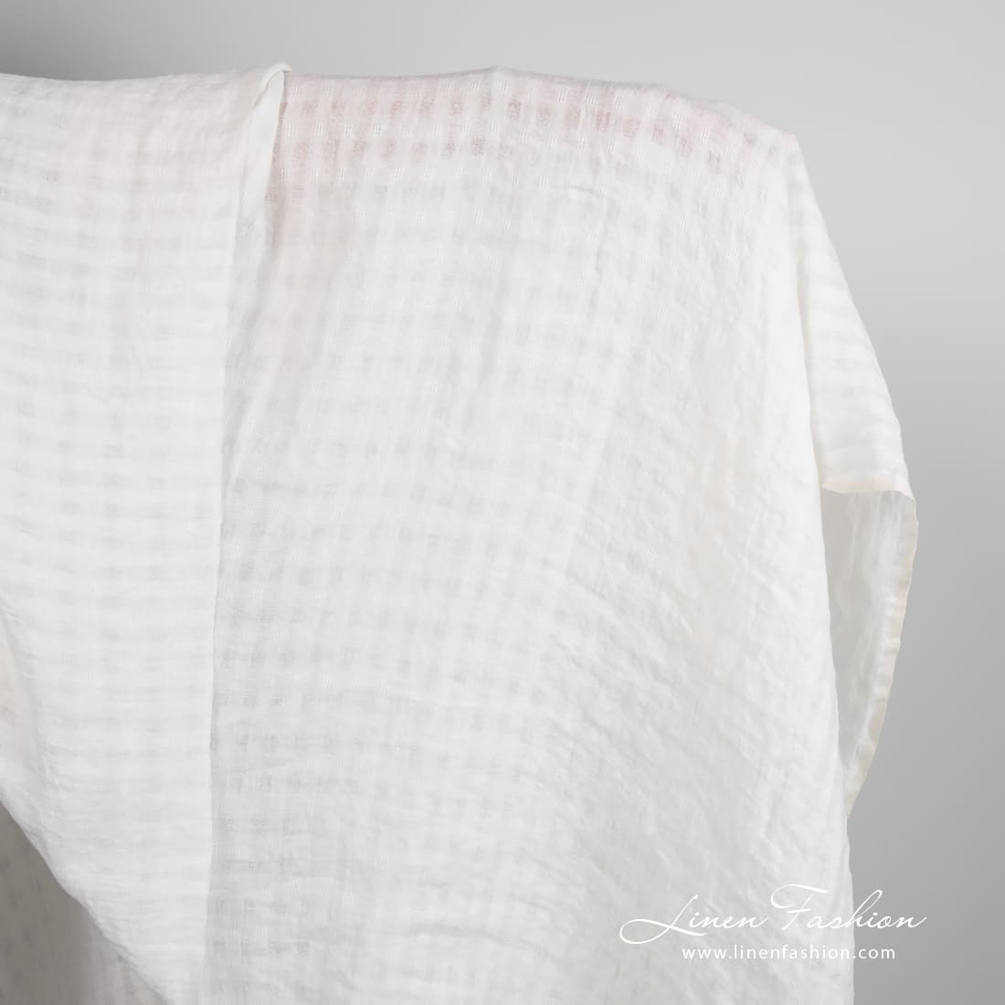 Off-white linen fabric in transparent checks