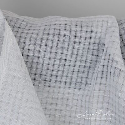 Bluish grey linen fabric in transparent checks 10 Linen fabric in transparent checks woven in bluish grey and white yarns