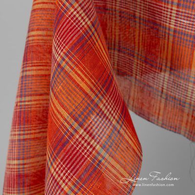 Transparent linen fabric in red orange checks 7 Transparent 100% linen fabric in red orange checks.