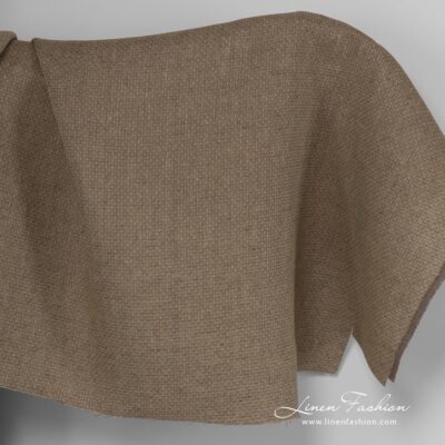 Brown melange linen fabric with spots.