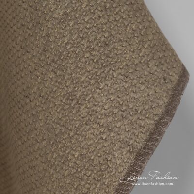 100% linen fabric in brown colour with spots.