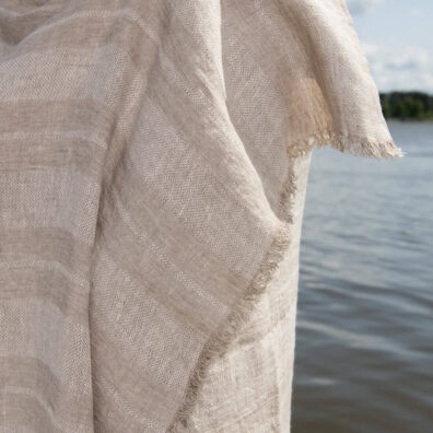 Linen beach towel in sand colour stripes, with fringe