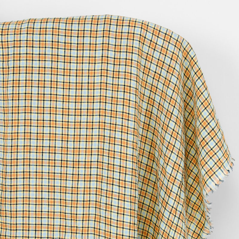 Linen fabric orange and pale blue checks, washed