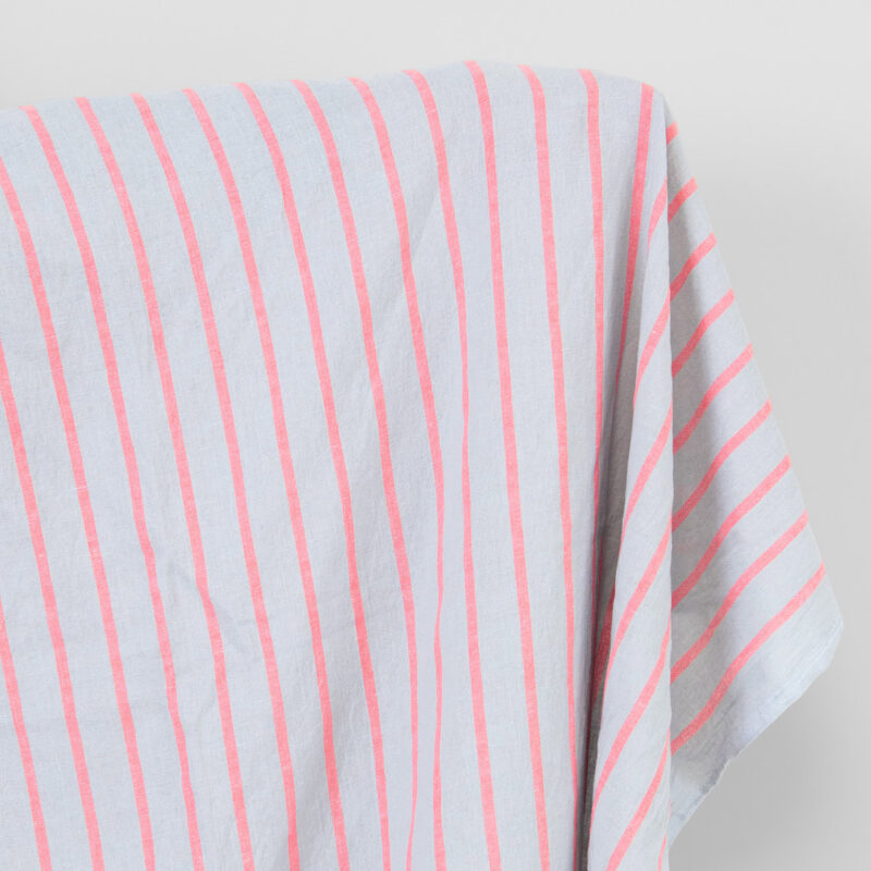 Linen cotton fabric light grey with bright red stripes, washed