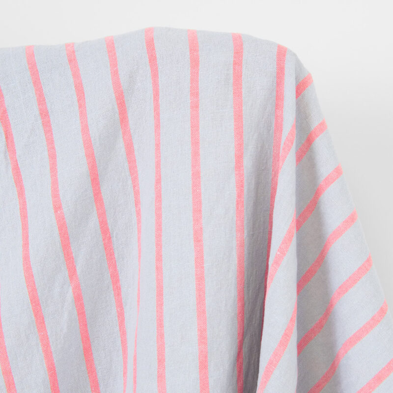 Linen cotton fabric light grey with bright red stripes, washed
