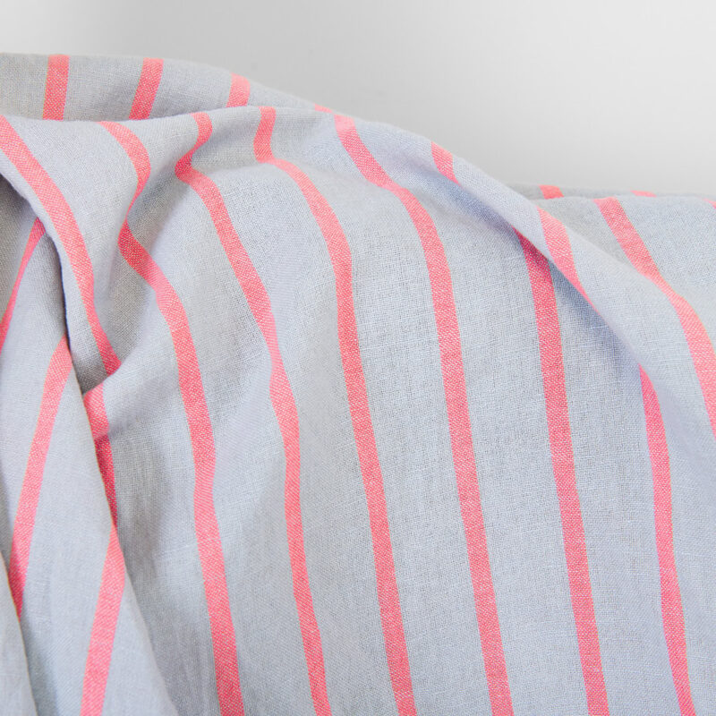Linen cotton fabric light grey with bright red stripes, washed